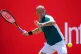 Dan Evans in action against Frances Tiafoe in their Men's Singles match on day eight of The Queen's Club Championship, London, June 16, 2025