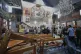Syrian citizens and security forces inspect the damage inside Mar Elias church where a suicide bomber detonated himself in Dweil'a in the outskirts of Damascus, Syria, June 22, 2025
