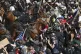 Demonstrators standoff against law enforcement on horseback during a protest, June 14, 2025, in Los Angeles