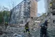 Rescuers run to a shelter to hide from an air raid during a Russian missile and drone barrage in Kyiv, Ukraine, June 17, 2025