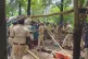 Forest Department officials break down the shelters of Jenu Kuruba people who had reclaimed their old village inside Nagarhole Tiger Reserve [Pix: Survival International]