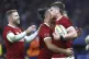 Joe McCarthy of the British & Irish Lions, right, is congratulated by teammates James Lowe and Elliot Daly, left, after scoring a try during their rugby match against the Western Force in Perth, Australia, June 28, 2025