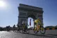 Slovenia's Tadej Pogacar, wearing the overall leader's yellow jersey, passes the Arc de Triomphe during the twenty-first and last stage of the Tour de France cycling race over 108.4 kilometers (67.4 miles), July 18, 2021
