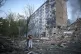 Residents embrace after a Russian missile hit a multi-storey apartment during Russia's combined missile and drone air attack in Kyiv, Ukraine, June 17, 2025