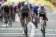 Netherlands' Mathieu van der Poel (centre) celebrates as he crosses the finish line to win the second stage of the Tour de France cycling race over 209.1 kilometers (129.9 miles) with start in Lauwin-Planque and finish in Boulogne-sur-Mer, July 6, 2025