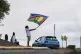 A woman waves a Kanak and Socialist National Liberation Front (FLNKS) flag in Noumea, New Caledonia, May 15, 2024