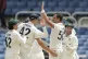 Teammates greet Australia's Mitchell Starc for the dismissal of West Indies' Kevlon Anderson on day three of the third Test cricket match at Sabina Park in Kingston, Jamaica, Monday, July 14, 2025