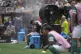 almeiras' Vitor Roque sits on the side of the pitch in a cooling mist after being substituted during the Club World Cup round of 16 soccer match between Palmeiras and Botafogo in Philadelphia, Sunday, June 29, 2025