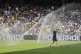 Auckland City's Gerard Garriga cools off under the sprinklers during a water break in the Club World Cup Group C soccer match between Auckland City and Boca Juniors in Nashville, Tenn., June 24, 2025