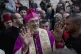 Christians celebrate the arrival of Archbishop Pierbattista Pizzaballa (centre), after he crossed an Israeli military checkpoint from Jerusalem ahead of midnight Mass at the Church of the Nativity, in the West Bank city of Bethlehem, December 24, 2018