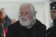 Environmental activist Paul Watson smiles as he arrives at Charles de Gaulle's airport in Roissy, north of Paris, December 20, 2025