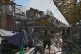 A woman looks at a ruined city market following Russia's drone attack in Odesa, Ukraine, July 24, 2025