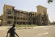 An army soldier walks in front of the Republican Palace in Khartoum, Sudan, after it was taken over by Sudan's army, March 21, 2025