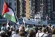 Demonstrators carrying Palestinian flags look on as the Ship to Gaza boat 'Handala' arrives at the port of Malmö, Sweden, May 8, 2024
