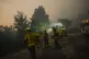 Firefighters work as the fire progresses in A Cañiza, Pontevedra province, northwest Spain, July 30, 2025