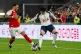 Tottenham Hotspur's Son Heung-min (right) battles for the ball with Arsenal's Ben White during a friendly soccer match between Arsenal FC and Tottenham Hotspur, July 31, 2025, at the Hong Kong Football Festival at the Kai Tak Stadium