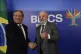 Brazilian President Luiz Inacio Lula da Silva (right) flashes a thumbs up as he and China's Premier Li Qiang pose for photos during their bilateral meeting ahead of the upcoming 17th annual BRICS summit in Rio de Janeiro, July 5, 2025