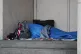 Homeless person sleeping rough in a doorway