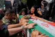 Relatives mourn over the flag-draped coffin of Mahan Setareh, a member of the paramilitary Basij force who was killed in Israeli attacks, during his funeral ceremony in Tehran, Iran, June 26, 2025