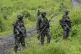 M23 rebels stand with their weapons in Kibumba, in the eastern of Democratic Republic of Congo, December 23, 2022