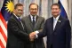 Malaysia's Prime Minister Anwar Ibrahim (centre) Cambodia's Prime Minister Hun Manet (left) and Thailand's acting Prime Minister Phumtham Wechayachai pose for photos after talks on a possible ceasefire between Thailand and Cambodia in Putrajaya, Malaysia, July 28, 2025