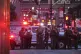 New York State Police troopers gather on 52nd Street outside a Manhattan office building where two people were shot, including a New York police officer, July 28, 2025, in New York