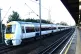 A C2C train is seen passing a station in London