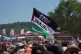 A pro Palestinian flag can be seen in the crowd by the Pyramid stage during the Glastonbury Festival at Worthy Farm in Somerset, June 27, 2025