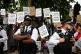 Metropolitan Police officers observe a protest in support of Palestine Action, organised by the Defend Our Juries group, in front of the Mahatma Gandhii statue in Parliament Square, central London, July 5, 2025
