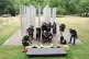 Members of the press take photographs of wreaths laid by the Mayor of London Sir Sadiq Khan and Prime Minister Sir Keir Starmer at the 7/7 Memorial, in Hyde Park, London, to mark the anniversary of the terrorist attacks in London on July 7th 2005 that killed 52 people. Picture date: Monday July 7, 2025