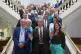 Reform UK leader Nigel Farage is accompanied by councillor Brian Collins (left) and the Head of Kent County Council, Linden Kemkaran (right) as he poses for a photo with members of Kent County Council, during his visit to the Reform UK group at Kent at Kent County Council at County Hall, Maidstone, July 7, 2025
