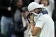 Grigor Dimitrov reacts after retiring injured during his Gentlemen's Singles match against Jannik Sinner on day eight of the 2025 Wimbledon Championships at the All England Lawn Tennis and Croquet Club, London, July 7, 2025