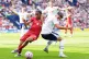 Liverpool's Rio Ngumoha (left) and Preston North End's Pol Valentin battle for the ball during the pre-season friendly match at Deepdale Stadium, Preston, July 13, 2025
