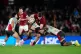 British and Irish Lions' Scott Cummings (centre) is tackled by First Nations and Pasifika XV's Darcy Swain during the Qatar Airways Lions Tour match at the Marvel Stadium in Melbourne, Australia, July 22, 2025