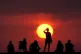 People turning out to watch the sunrise at Cullercoats Bay, North Tyneside