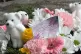 A view of a message paying tribute to Alice da Silva Aguiar, nine, Bebe King, six, and Elsie Dot Stancombe, seven, is seen among floral tributes in the Town Hall Gardens in Southport, July 29, 2025