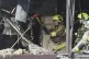 Firefighters work in a destroyed apartment building after a Russian attack in Kyiv, Ukraine, July 21, 2025