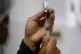 A healthcare worker prepares a shot of the Pfizer COVID-19 vaccine in La Paz, Bolivia, January 7, 2025