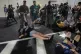 RESISTANCE: Police officers disperse demonstrators blocking a road during a protest demanding the immediate release of hostages held by Hamas and calling for the Israeli government to reverse its decision to take over Gaza City and other areas in the Gaza Strip, in Jerusalem yesterday