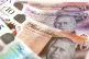 A view of £5, £10, £20 and £50 bank notes