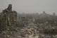 People walk down a street surrounded by buildings destroyed by Israeli bombardments in the Gaza Strip, July 29, 2025