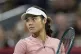 Emma Raducanu of the United Kingdom reacts during her game against Amanda Anisimova of the United States during third round tennis action at the National Bank Open in Montreal, Friday, Aug. 1, 2025