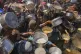 Palestinians struggle to get donated food at a community kitchen in Gaza City, northern Gaza Strip, Monday, Aug. 4, 2025