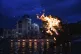 Bonfires are lit along the Motoyasu River in front of the Atomic Bomb Dome during a remembrance ceremony in Hiroshima, August 5, 2025 on the eve of the 80th anniversary of the atomic bombing