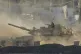 An Israeli tank moves near the border of the Gaza Strip in southern Israel, August 6, 2025