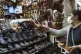 A vendor sells sandals known as 
