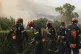 Firefighters prepare to fight against a wildfire in Vounteni village, on the outskirts of Patras, western Greece, August 13, 2025