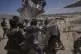 Palestinians rush to collect humanitarian aid airdropped by parachutes into Deir al-Balah, central Gaza Strip, August 5, 2025