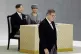 Japan's Prime Minister Shigeru Ishiba (centre) walks past Japan's Emperor Naruhito and Empress Masako, after delivering a speech at a memorial service marking the 80th anniversary of Japan's World War II defeat, at the Nippon Budokan hall, August 15, 2025, in Tokyo