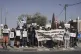 Palestinian and Israeli activists take part in a protest against the killing of journalists in the Gaza Strip as they gather in the West Bank town of Beit Jala, August 15, 2025